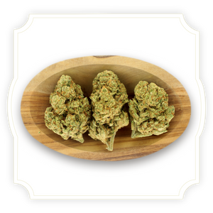 Amnesia Hypro CBD flower in wooden bowl with white background